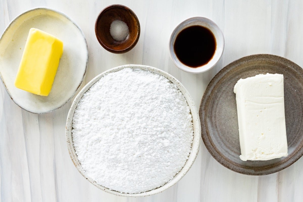 cream cheese frosting ingredients in bowls. 