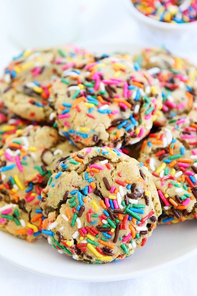 Sprinkle Chocolate Chip Cookies Recipe on twopeasandtheirpod.com Chocolate chip cookies covered in bright colored sprinkles. These cookies are perfect for birthdays, parties, or any day! Chocolate Chip Cookies with Sprinkles