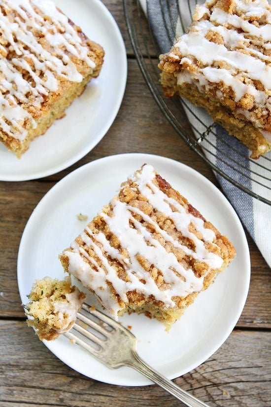 Brown Butter Zucchini Coffee Cake Recipe on twopeasandtheirpod.com Trying to use up your summer zucchini? You HAVE to make this cake. It is great for breakfast, brunch, or dessert! Brown Butter Zucchini Coffee Cake on plate with bite on fork