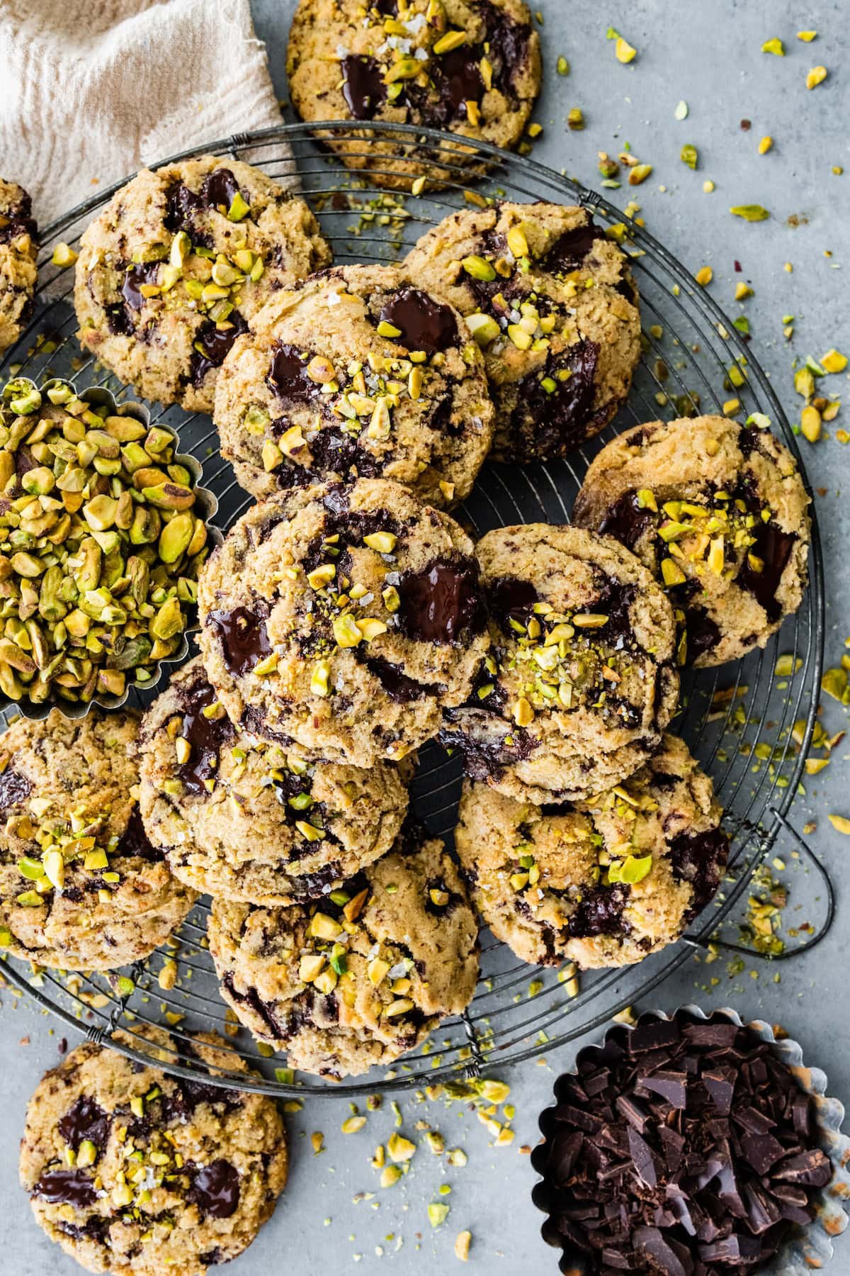 dark chocolate chunk pistachio cookies on cooling rack.