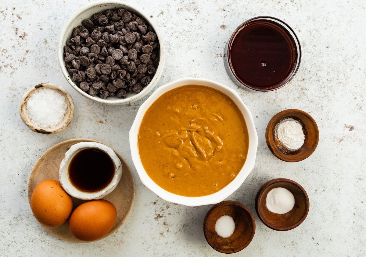 ingredients in bowls to make flourless peanut butter blondies.