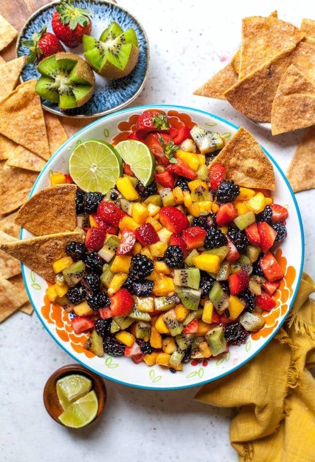 Fruit Salsa in bowl with cinnamon sugar tortilla chips.