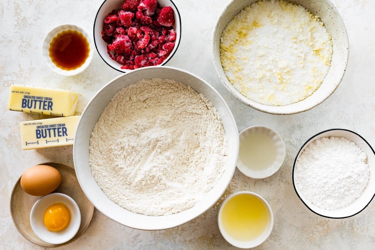 ingredients in bowls to make lemon raspberry cookies.