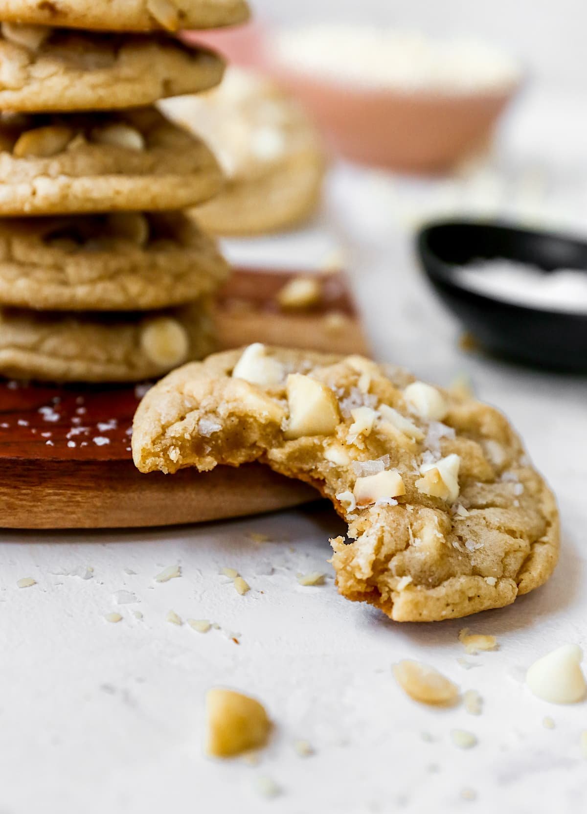 white chocolate macadamia nut cookie with bite missing.