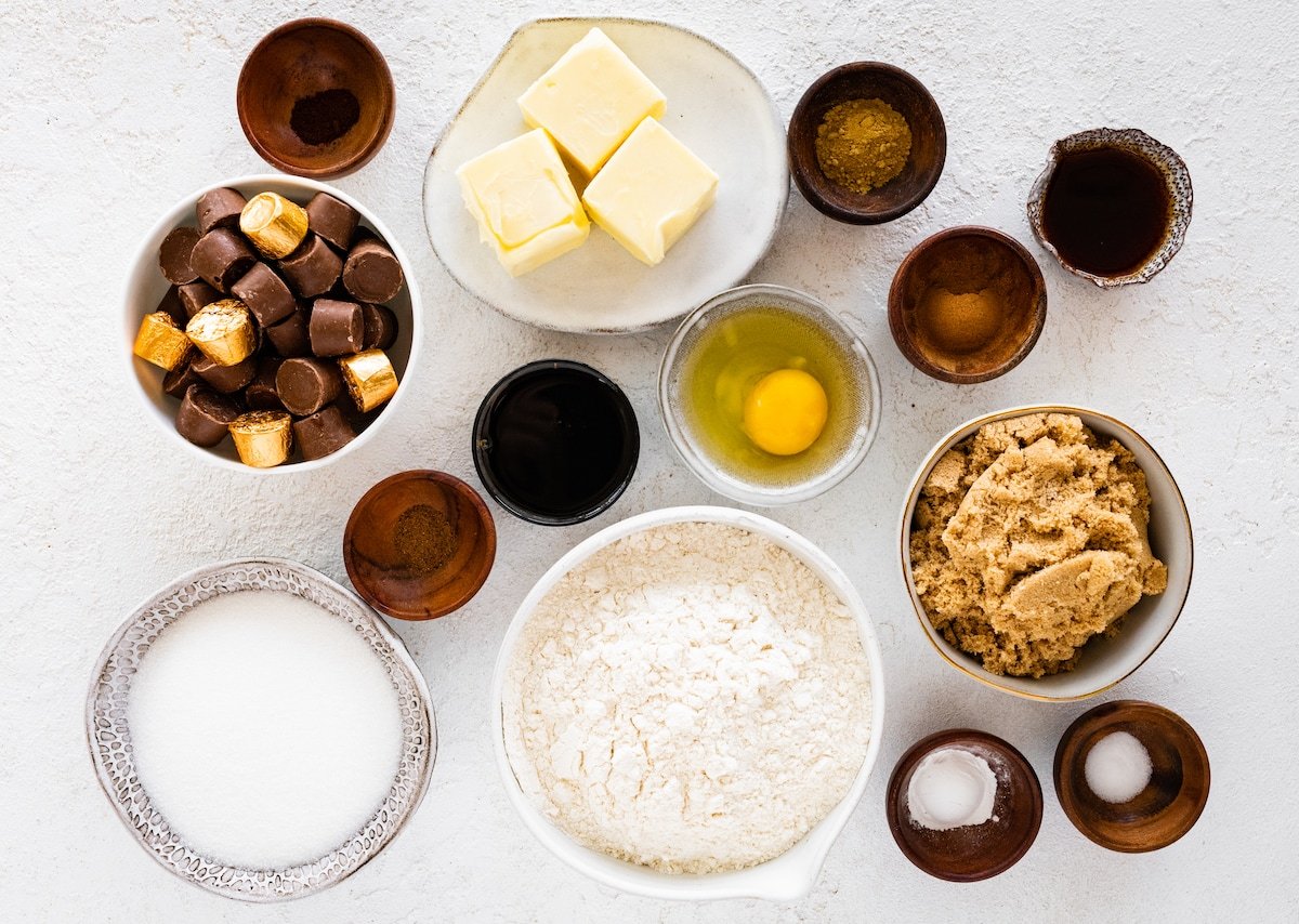 ingredients in bowls to make ginger molasses rolo cookies.