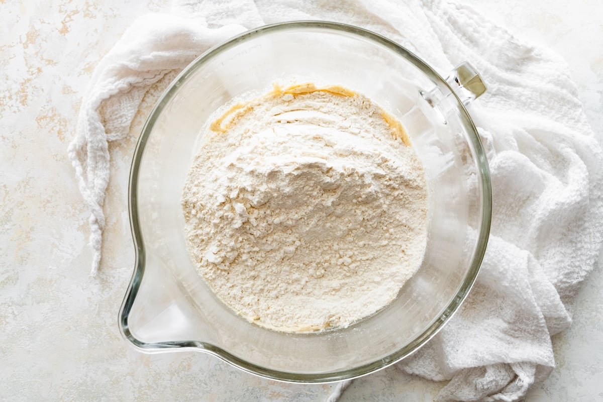 dry ingredients being added to brown butter and sugar mixture.