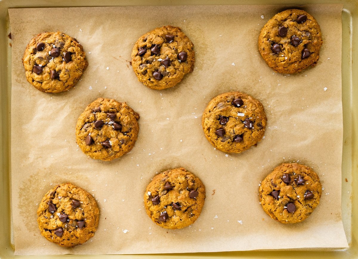 pumpkin oatmeal chocolate chip cookies on baking sheet.