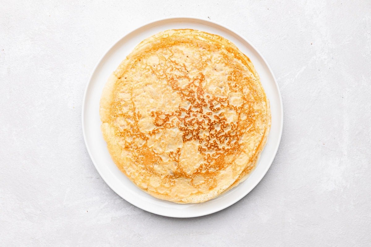 cooked crepes on plate.