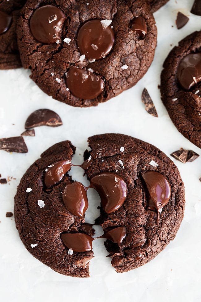 Chocolate Cookies Made With Cocoa Powder, Chocolate Chips, Chocolate Chunks, And Finished With A Sprinkling Of Flaky Sea Salt. This Is The ULTIMATE Chocolate Cookie Recipe! #cookies #chocolate #chocolatecookies #dessert #baking #valentinesday #christmascookie chocolate cookie with melted chocolate chunks