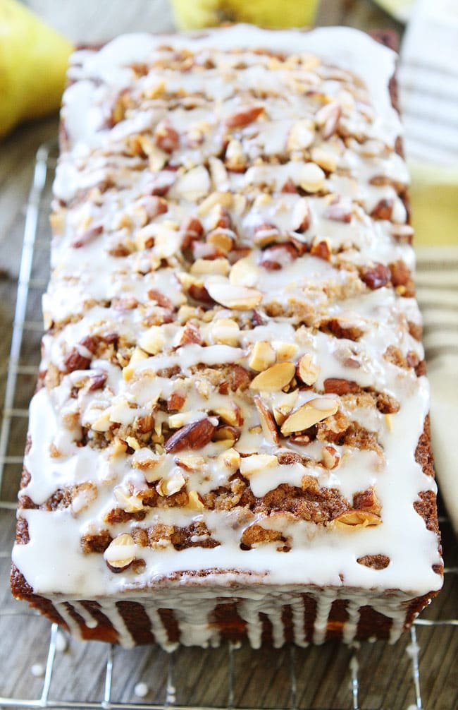 Pear Almond Streusel Bread Recipe on twopeasandtheirpod.com This easy pear quick bread has a sweet almond streusel topping and glaze. It is a fall favorite! Easy Pear Bread recipe with almond streusel topping
