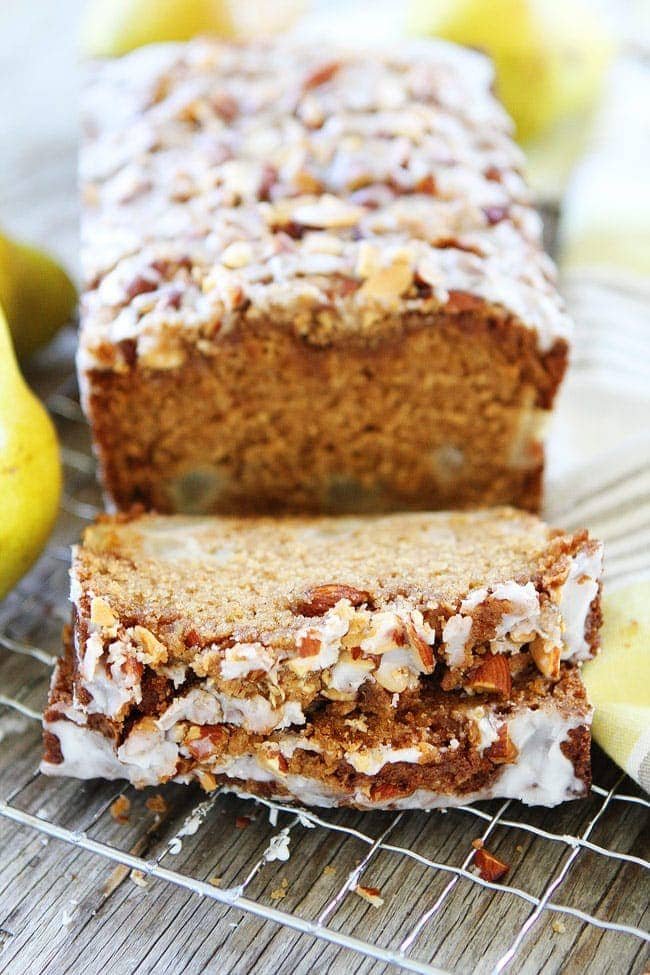 Pear Almond Streusel Bread Recipe on twopeasandtheirpod.com This easy pear quick bread has a sweet almond streusel topping and glaze. It is great for breakfast, brunch, or dessert. Pear Bread on cooling rack
