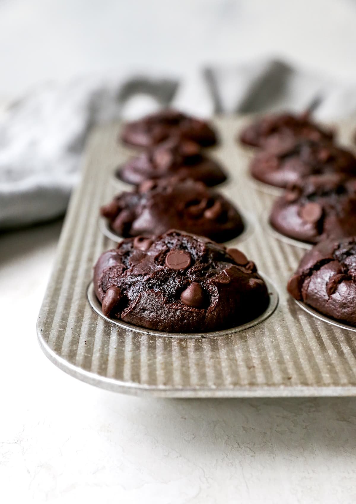 Chocolate Muffins in muffin tin.