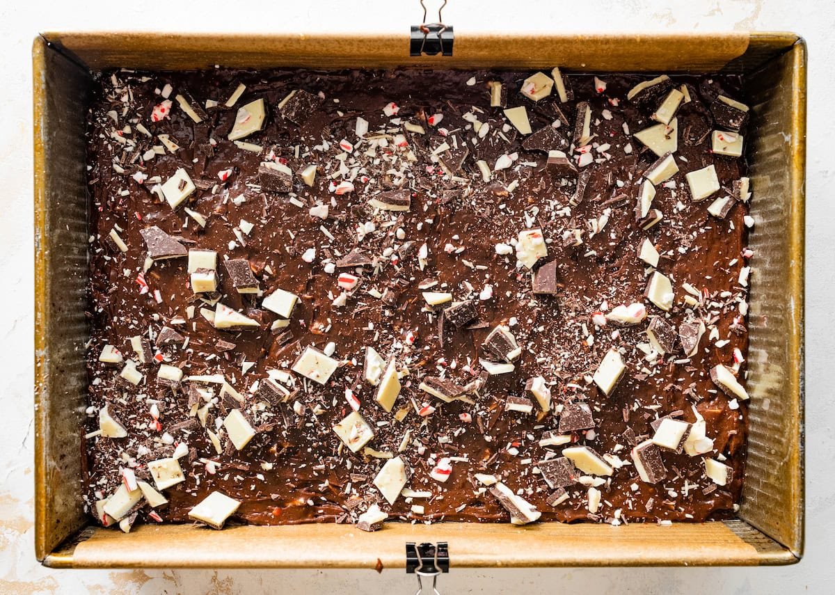 peppermint bark brownie batter spread into pan ready to be baked.
