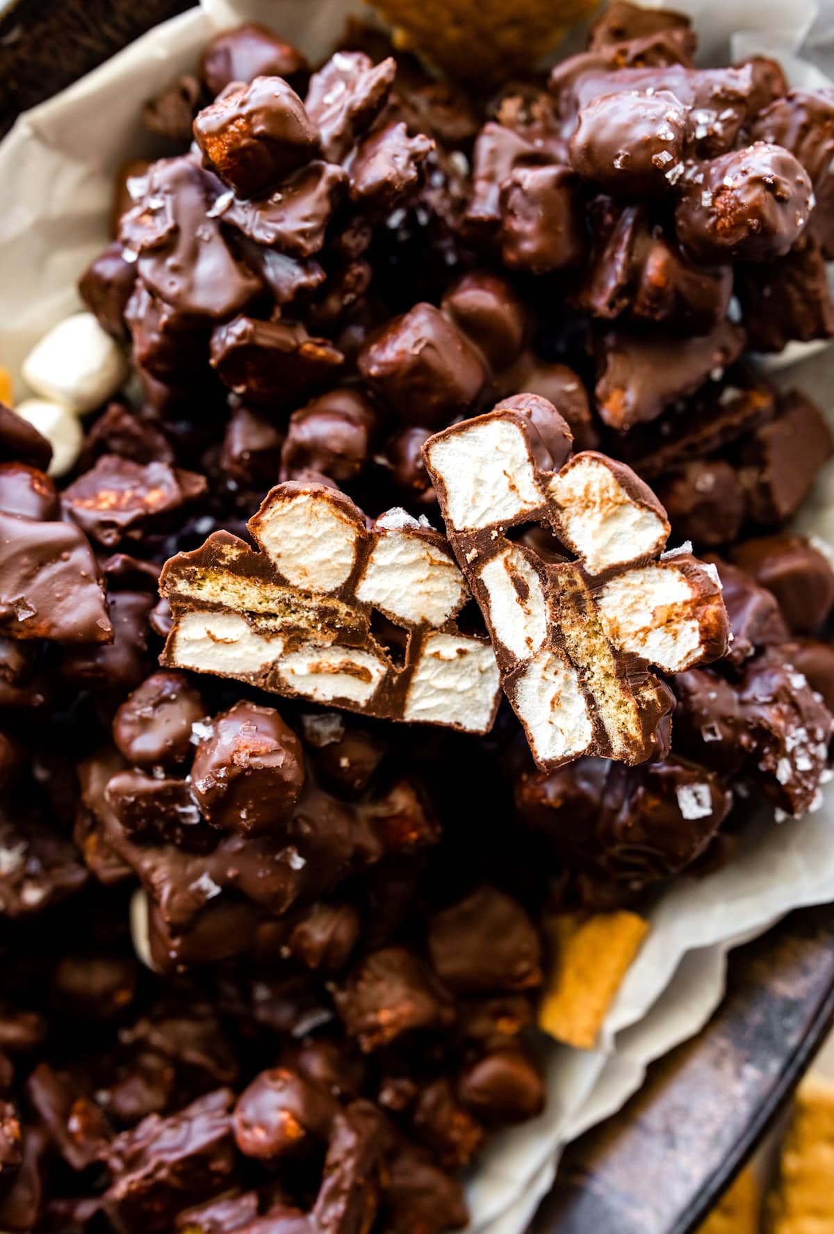 close up of s'mores clusters with mini marshmallows, graham crackers, and chocolate.