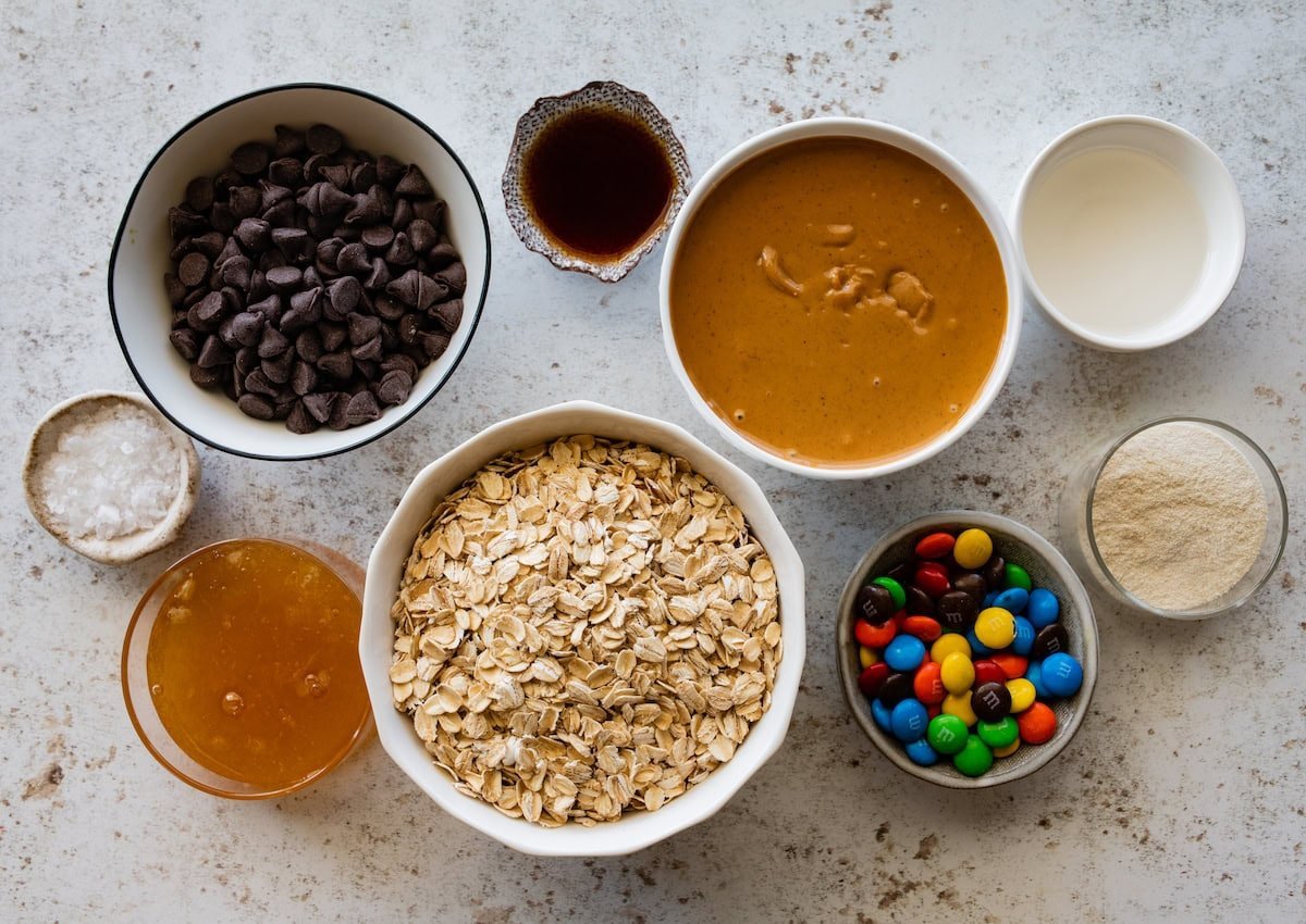 ingredients in bowls to make no bake monster cookie bars.