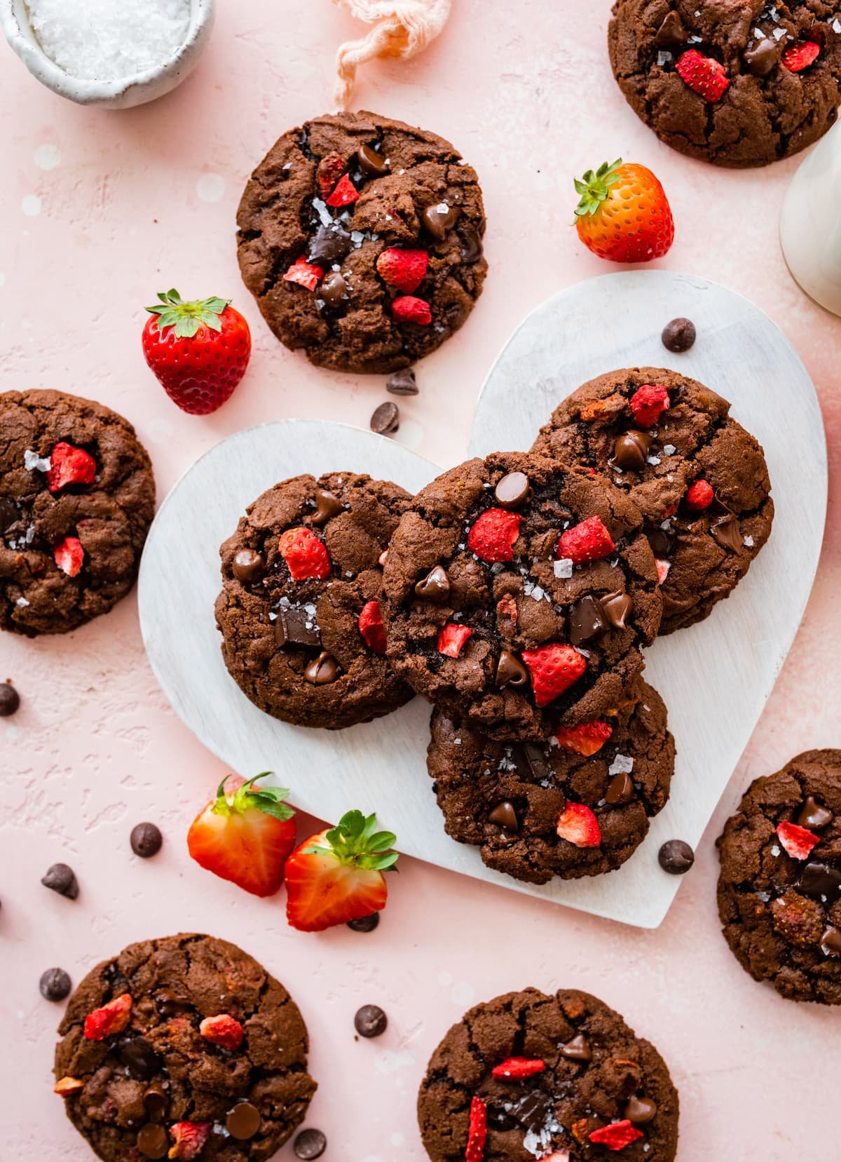 strawberry chocolate cookies on heart board.