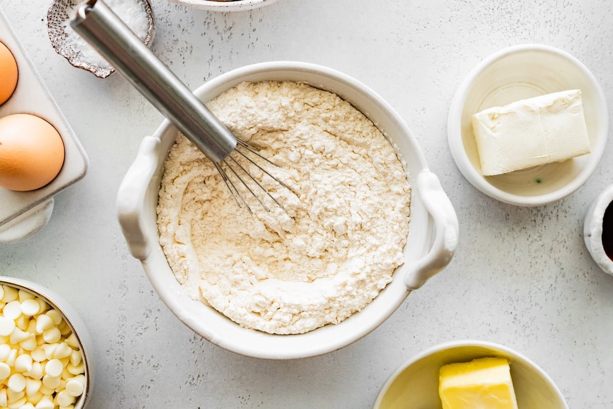 flour in mixing bowl with whisk.