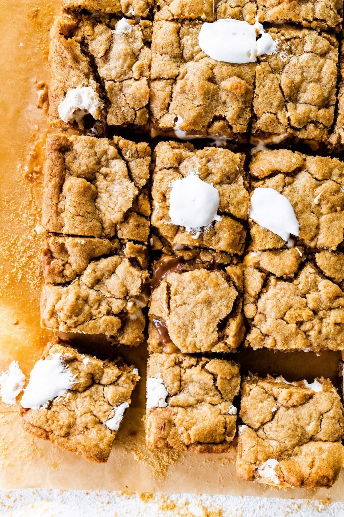 peanut butter s'mores bars cut into squares with marshmallow creme.
