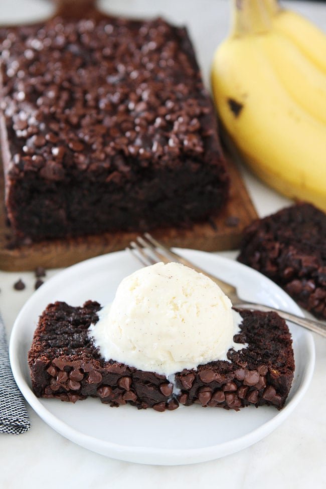 Gluten-Free Vegan Chocolate Banana Bread Recipe on twopeasandtheirpod.com You will never know this chocolate banana bread is gluten-free and vegan. It is SO good! Top it with ice cream and you have an amazing dessert! Chocolate Gluten-Free Banana Bread served with ice cream