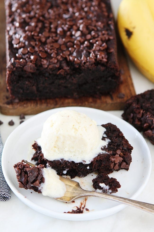 Gluten-Free Vegan Chocolate Banana Bread Recipe on twopeasandtheirpod.com This is the BEST banana bread recipe! You will never know it's gluten-free and vegan. It is SO moist, rich and delicious! Chocolate Vegan Banana Bread served Ala mode like cake