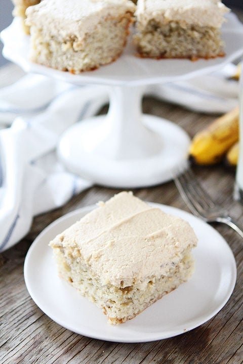 Banana Cake with Peanut Butter Frosting Recipe on twopeasandtheirpod.com So simple and SO good! Banana Cake bars with creamy peanut butter frosting