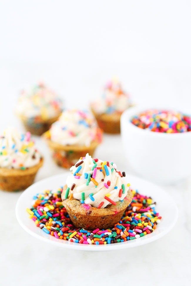 Sprinkle Chocolate Chip Cookie Cups topped with frosting are a fun and delicious dessert for parties, potlucks, or just because!