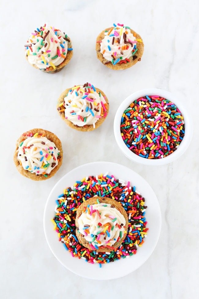 Sprinkle Chocolate Chip Cookie Cups topped with frosting are a fun and delicious dessert for parties, potlucks, or just because!