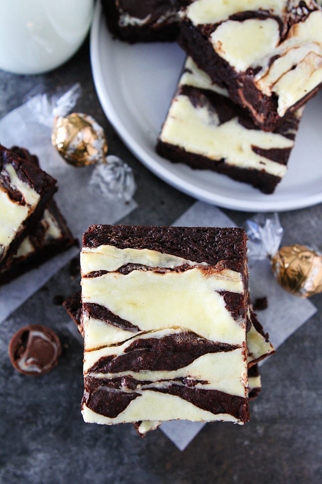 These fudgy Cheesecake Truffle Brownies have a layer of chocolate truffles and a smooth cheesecake swirl. They are so divine! Cheesecake Truffle Brownies