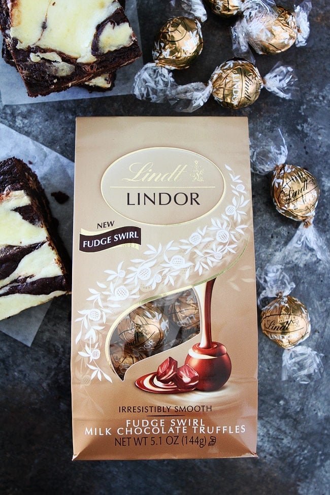 These fudgy Cheesecake Truffle Brownies have a layer of chocolate truffles and a smooth cheesecake swirl. Everyone LOVES these brownies! Cheesecake Truffle Brownies with truffles
