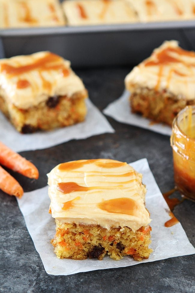 Easy Carrot Cake with Caramel Cream Cheese Frosting Recipe on twopeasandtheirpod.com This moist carrot cake is packed with carrots, pineapple, cinnamon, raisins and topped with a thick layer of caramel cream cheese frosting. It is the perfect spring dessert! Easy Carrot Cake with Caramel Cream Cheese Frosting