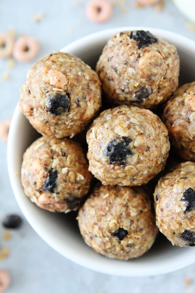 No-Bake Berry Energy Bites Recipe on twopeasandtheirpod.com We keep these easy and healthy energy bites in our refrigerator at all times. They are the perfect snack! No-Bake Berry Energy Bites Recipe