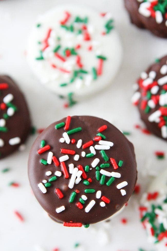 Chocolate Dipped Oreos Recipe on twopeasandtheirpod.com Oreo cookies dipped and chocolate and decorated with fun toppings! These cookies are easy to make at home and make a great holiday gift! Chocolate Dipped OREOS Recipe