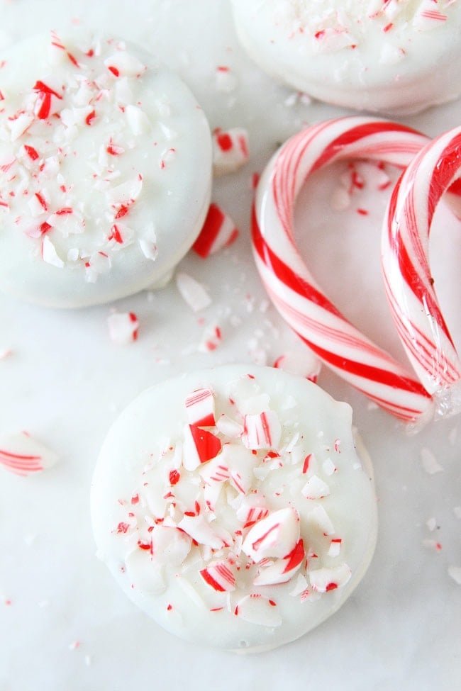 Chocolate Dipped Oreos Recipe on twopeasandtheirpod.com Oreo cookies dipped and chocolate and decorated with fun toppings! These cookies are easy to make at home and make a great holiday gift! Chocolate Dipped Oreos Recipe