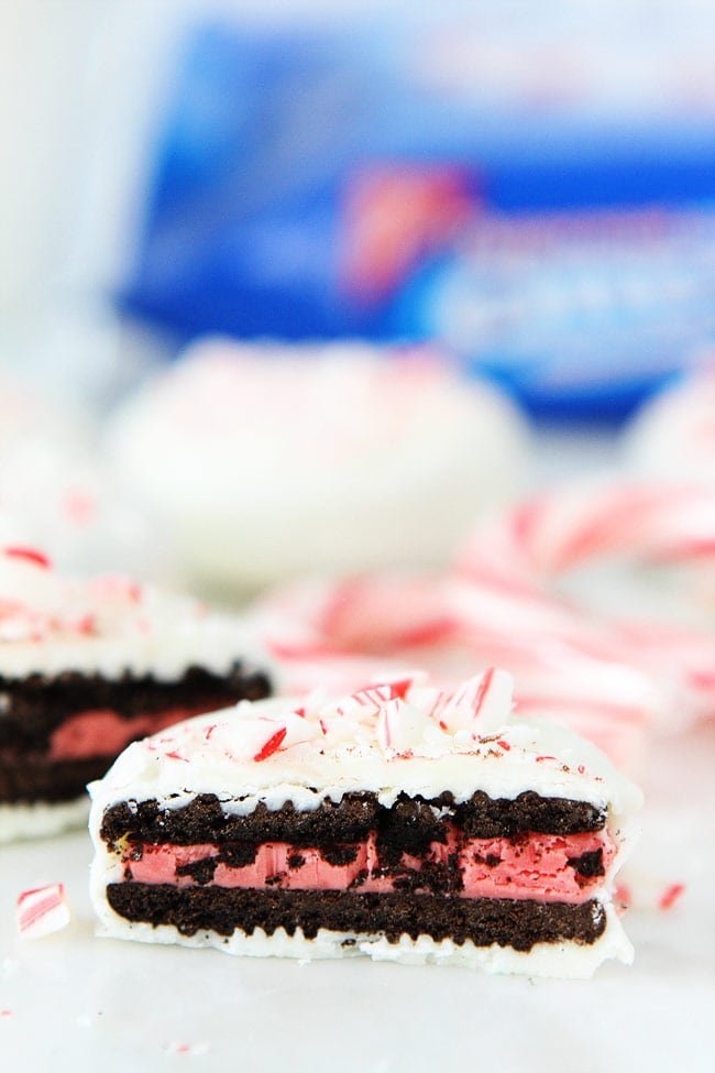 Chocolate Dipped Oreos Recipe on twopeasandtheirpod.com Oreo cookies dipped and chocolate and decorated with fun toppings! These cookies are easy to make at home and make a great holiday gift! Chocolate Dipped Oreos Recipe