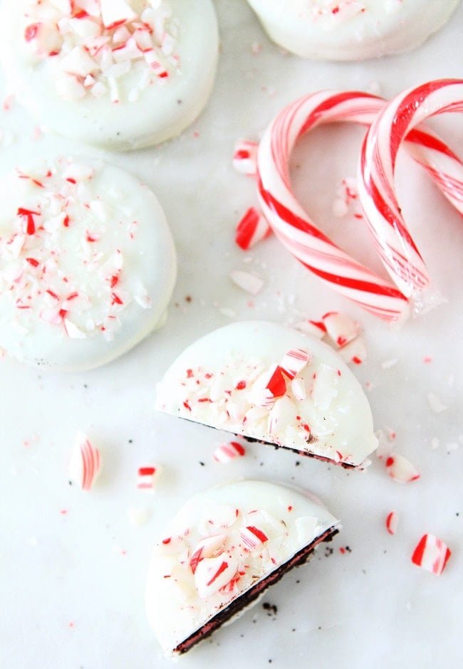 Chocolate Dipped Peppermint Oreos Recipe on twopeasandtheirpod.com Peppermint Oreo cookies dipped and chocolate and decorated with fun toppings! These cookies are easy to make at home and make a great holiday gift! Chocolate Dipped Peppermint Oreos
