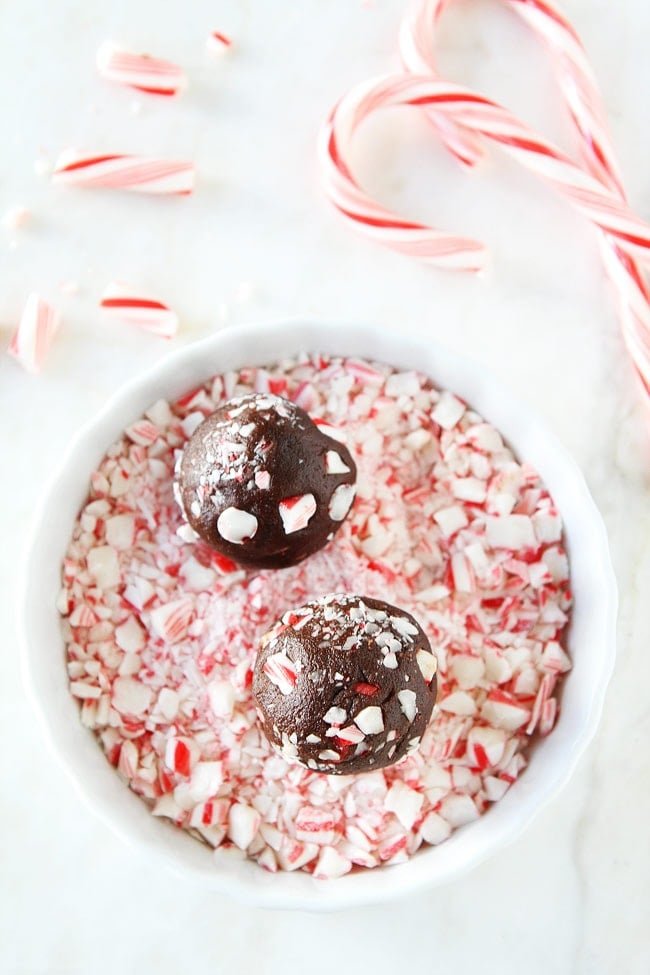 Chocolate Peppermint Crunch Cookie Recipe on twopeasandtheirpod.com Chocolate cookies with chocolate chips, peppermint crunch pieces, and candy cane pieces! These cookies are the PERFECT Christmas cookie! Chocolate Peppermint Crunch Cookie Recipe