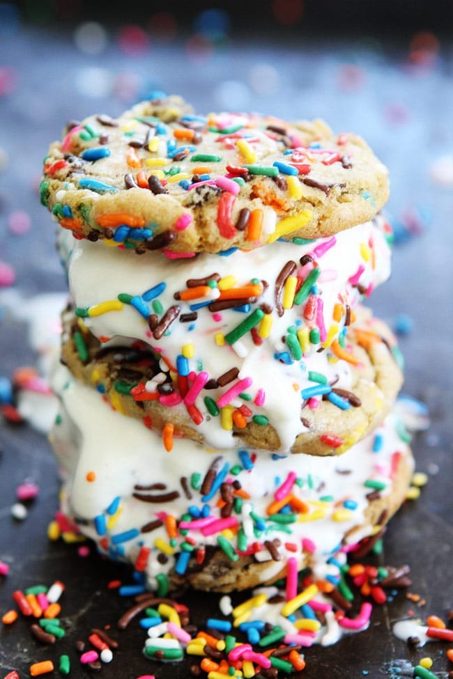 Sprinkle Chocolate Chip Cookie Ice Cream Sandwiches Recipe on twopeasandtheirpod.com Ice cream is sandwiched between two sprinkle chocolate chips cookies to create a fun and delicious dessert. The best part? They can be made in advance and kept in the freezer! Sprinkle Chocolate Chip Cookie Ice Cream Sandwiches Recipe