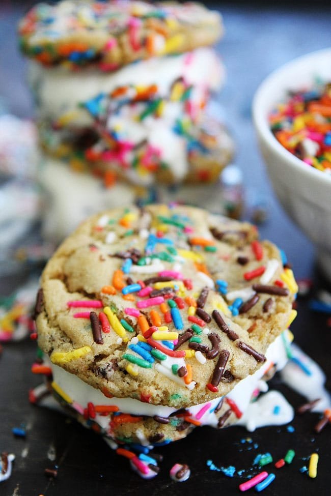 Sprinkle Chocolate Chip Cookie Ice Cream Sandwiches Recipe on twopeasandtheirpod.com Ice cream is sandwiched between two sprinkle chocolate chip cookies to create the BEST dessert ever! Sprinkle Chocolate Chip Cookie Ice Cream Sandwiches Recipe