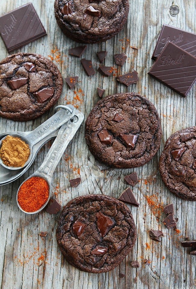 Dark Chocolate Chili Cookie Recipe on twopeasandtheirpod.com Rich chocolate cookies with a hint of cinnamon, cayenne pepper, and chili chocolate. You will love the kick in these cookies! Dark Chocolate Chili Cookie Recipe
