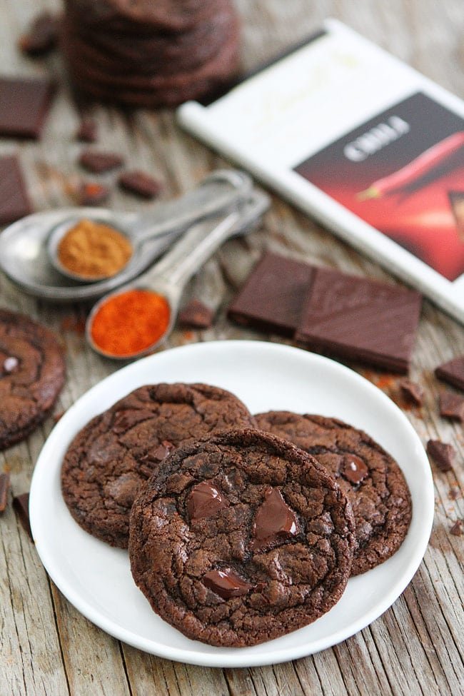 Dark Chocolate Chili Cookie Recipe on twopeasandtheirpod.com Rich chocolate cookies with a hint of cinnamon, cayenne pepper, and chili chocolate. I love the spicy kick that comes at the end! Dark Chocolate Chili Cookie Recipe