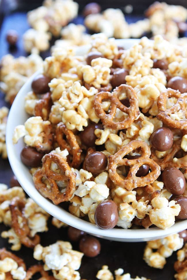 Peanut Butter Pretzel Popcorn Recipe on twopeasandtheirpod.com Love this sweet and salty popcorn! It's easy to make and perfect for parties or every day snacking! Peanut Butter Pretzel Popcorn Recipe