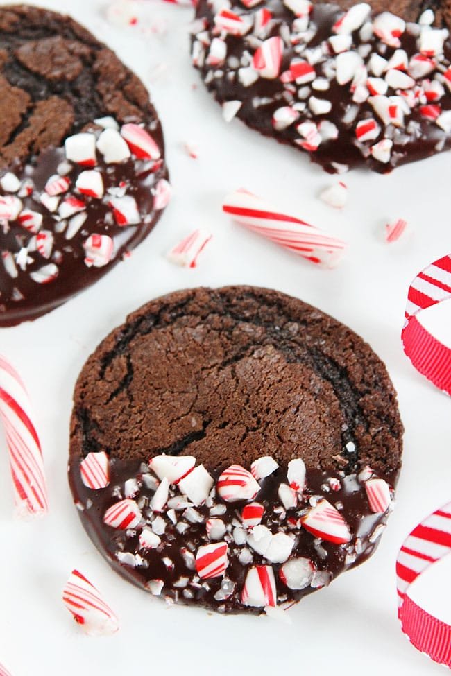 Chocolate Peppermint Ganache Cookies Recipe on twopeasandtheirpod.com These festive cookies are perfect for Christmas cookie exchanges, parties, and gift giving! Add them to your baking list today! Chocolate Peppermint Ganache Cookies Recipe