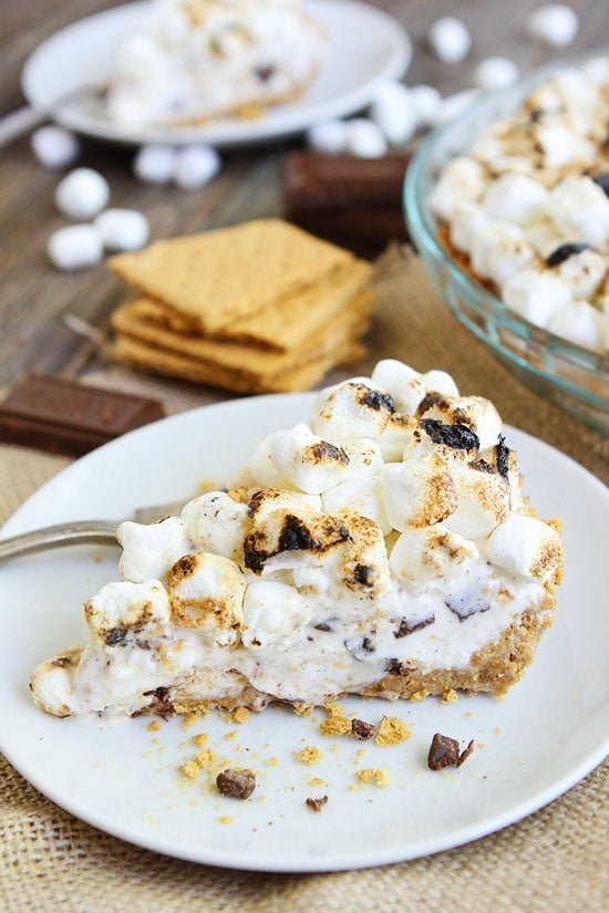 S'mores Ice Cream Pie Recipe on twopeasandtheirpod.com This S'mores pie is heavenly! A must make dessert for summertime! S'mores Ice Cream Pie Recipe
