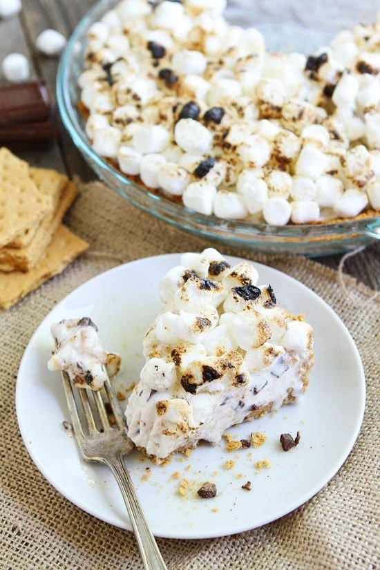 S'mores Ice Cream Pie Recipe on twopeasandtheirpod.com This is the BEST S'mores dessert and it's easy to make too! S'mores Ice Cream Pie Recipe