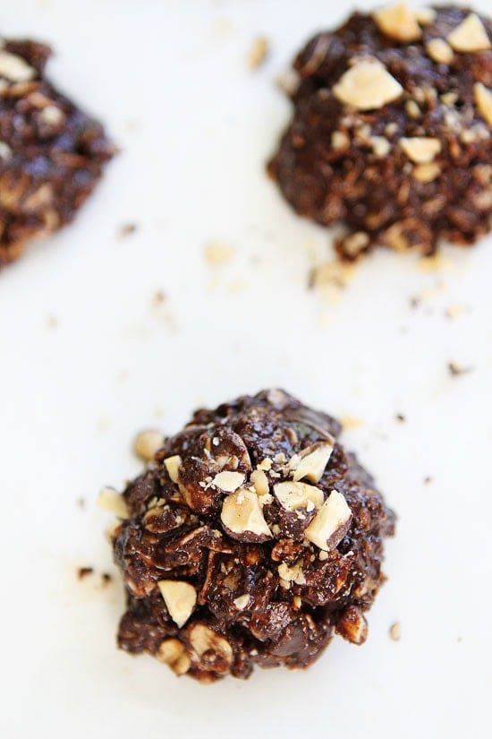 No-Bake Dark Chocolate Almond Cookie Recipe on twopeasandtheirpod.com These easy no-bake cookies are rich, fudgy, and the perfect summer treat! You will never know they are vegan and gluten-free! They are SO good! No-Bake Dark Chocolate Almond Cookie Recipe