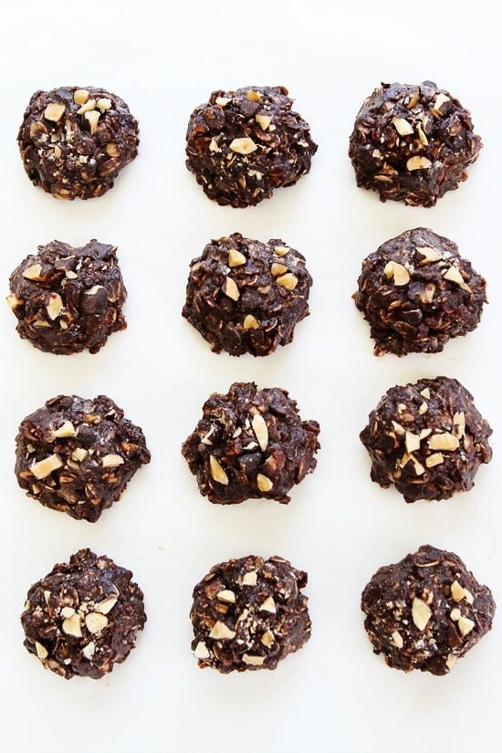 Vegan and Gluten Free No-Bake Dark Chocolate Almond Cookie Recipe on twopeasandtheirpod.com These easy no-bake cookies are rich, fudgy, and the perfect summer treat! No-Bake Dark Chocolate Almond Cookies