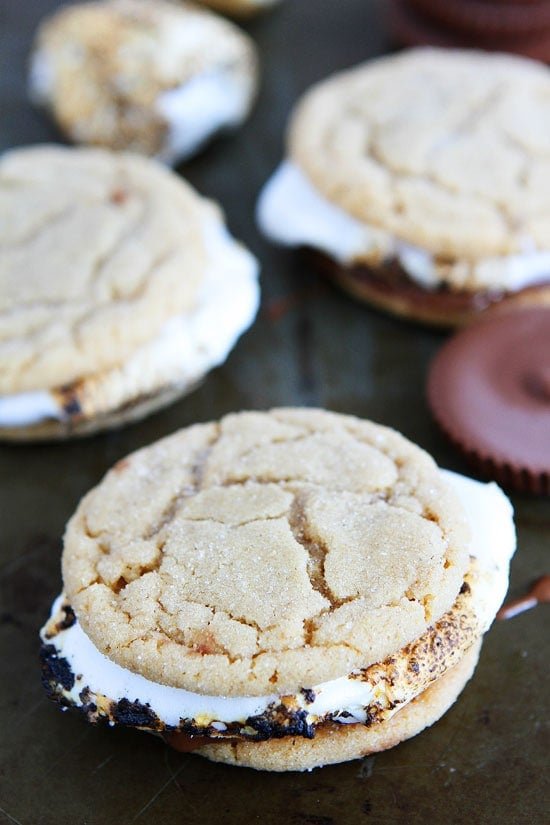 Peanut Butter Cookie S'mores Recipe on twopeasandtheirpod.com Peanut butter cookies, peanut butter cups, and marshmallows make the BEST s'mores! Peanut Butter Cookie S'mores Recipe