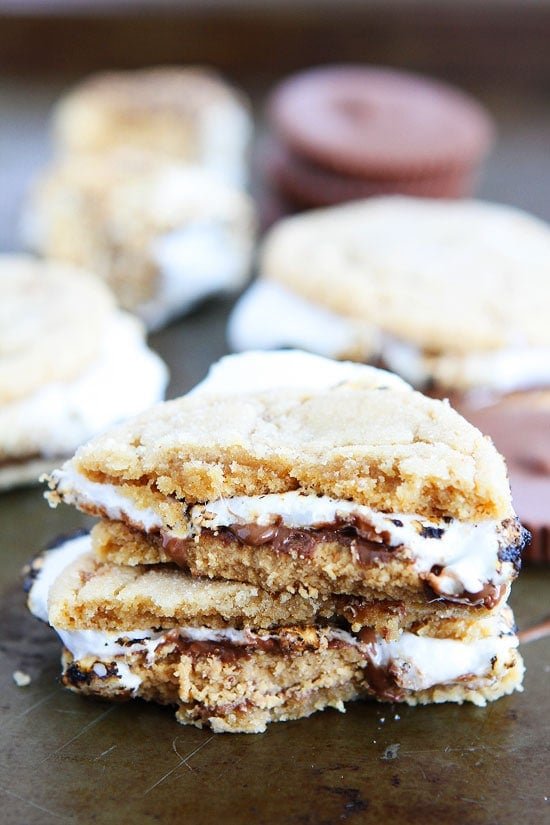 Peanut Butter Cookie S'mores Recipe on twopeasandtheirpod.com Peanut butter cookies, peanut butter cups, and marshmallows make the BEST s'mores! The perfect summertime treat! Peanut Butter Cookie S'mores Recipe
