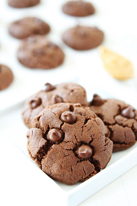 Flourless Chocolate Peanut Butter Cookies Recipe on twopeasandtheirpod.com. You will never know these soft and rich cookies are gluten-free! They are SO good and easy to make too! Gluten free Chocolate Peanut Butter Cookies no flour