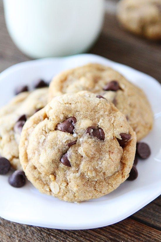 Whole Wheat Oatmeal Chocolate Chip Cookies on twopeasandtheirpod.com These cookies are made with whole wheat flour, coconut oil, and oats! They are SO good you will never know they are a healthier cookie! Whole Wheat Oatmeal Chocolate Chip Cookies